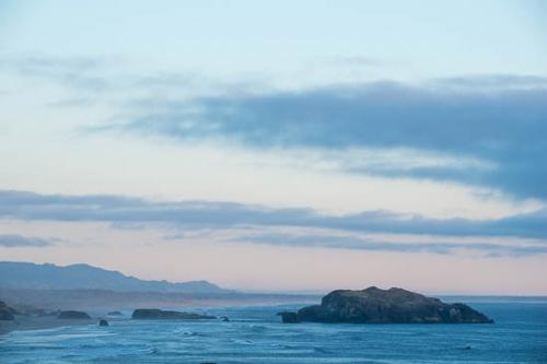 Beach;Blue;Boulder;Boulders;Cloud;Cloud Formation;Clouds;Coast;Coastline;Mountain;Ocean;Oregon;Pink;Rock Formations;Rocks;Rocky;Sea;Sea Stacks;Seascape;Shore;Shoreline;Waves